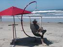 Portable C-Frame with a hanging beach swing at the beach