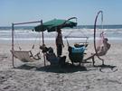 Header Frame with Double Chair rope hammock Beach Swing, and two C-Frames with single Beach Swings at family B-B-Q.